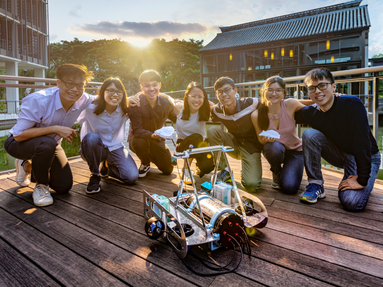 A group of students with a robot