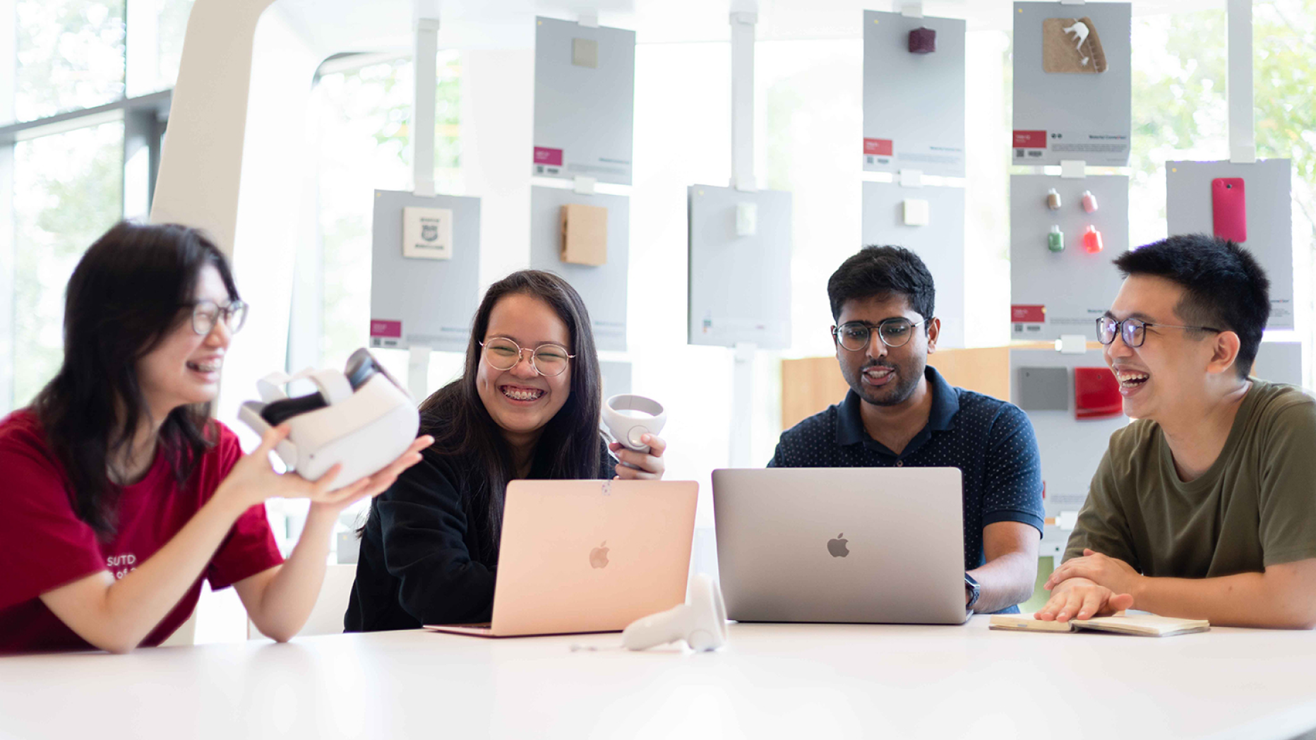 Students smiling holding a VR headset