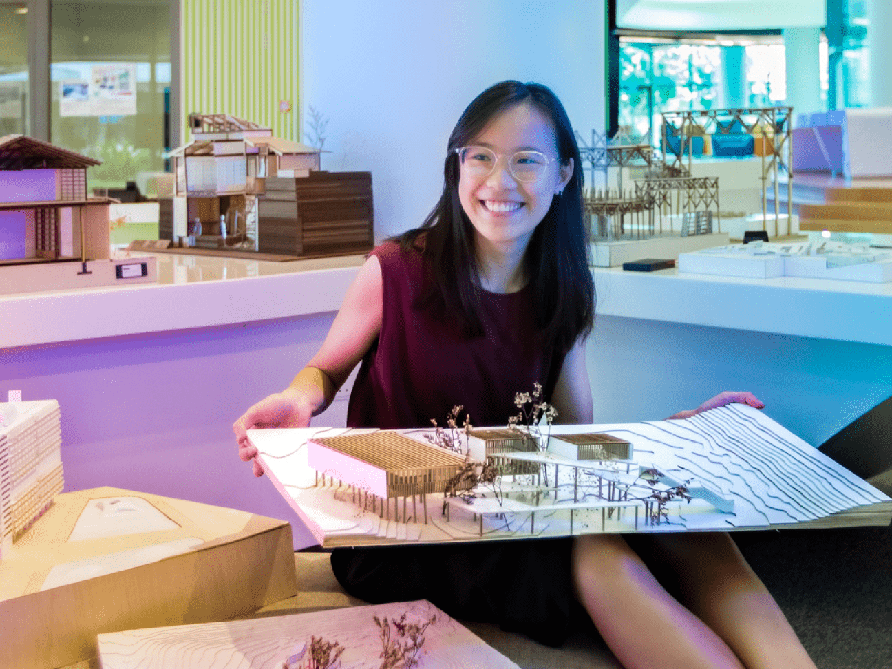 Woman holding an architectural model