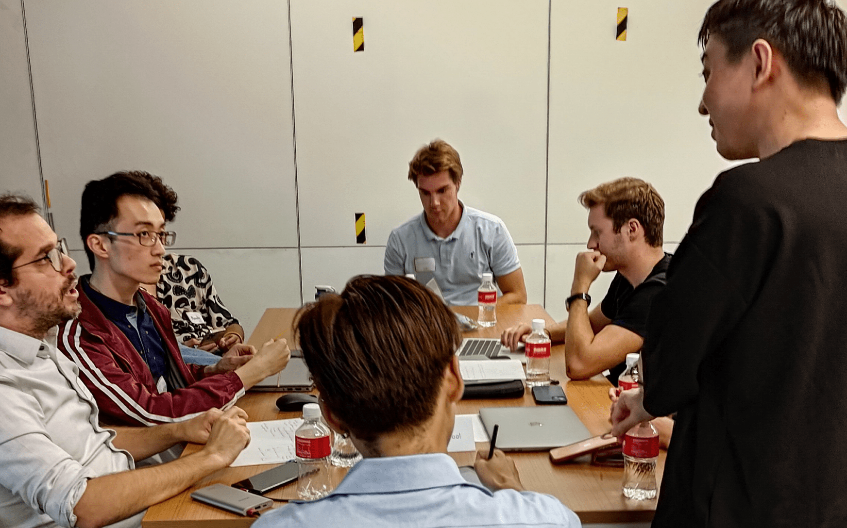 Men sitting around a table having a discussion